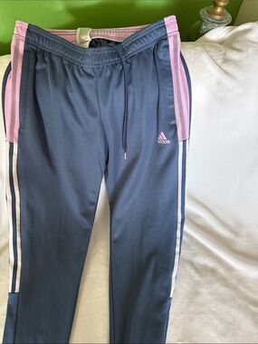 Women’s Adidas Blue/Pink Track Pants with zipper at ankle - size medium.